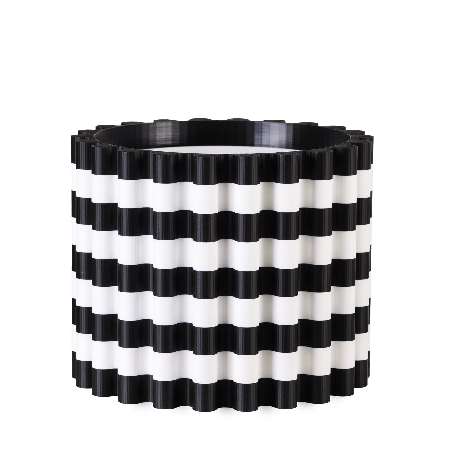 Black and white striped planter on a white background