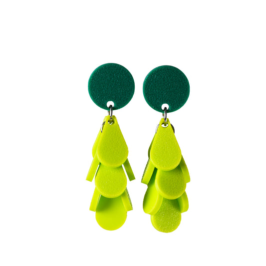 Dark green and light green earrings on a white background